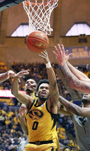 No. 14 WVU beats Missouri 74-51 in Big 12/SEC Challenge
